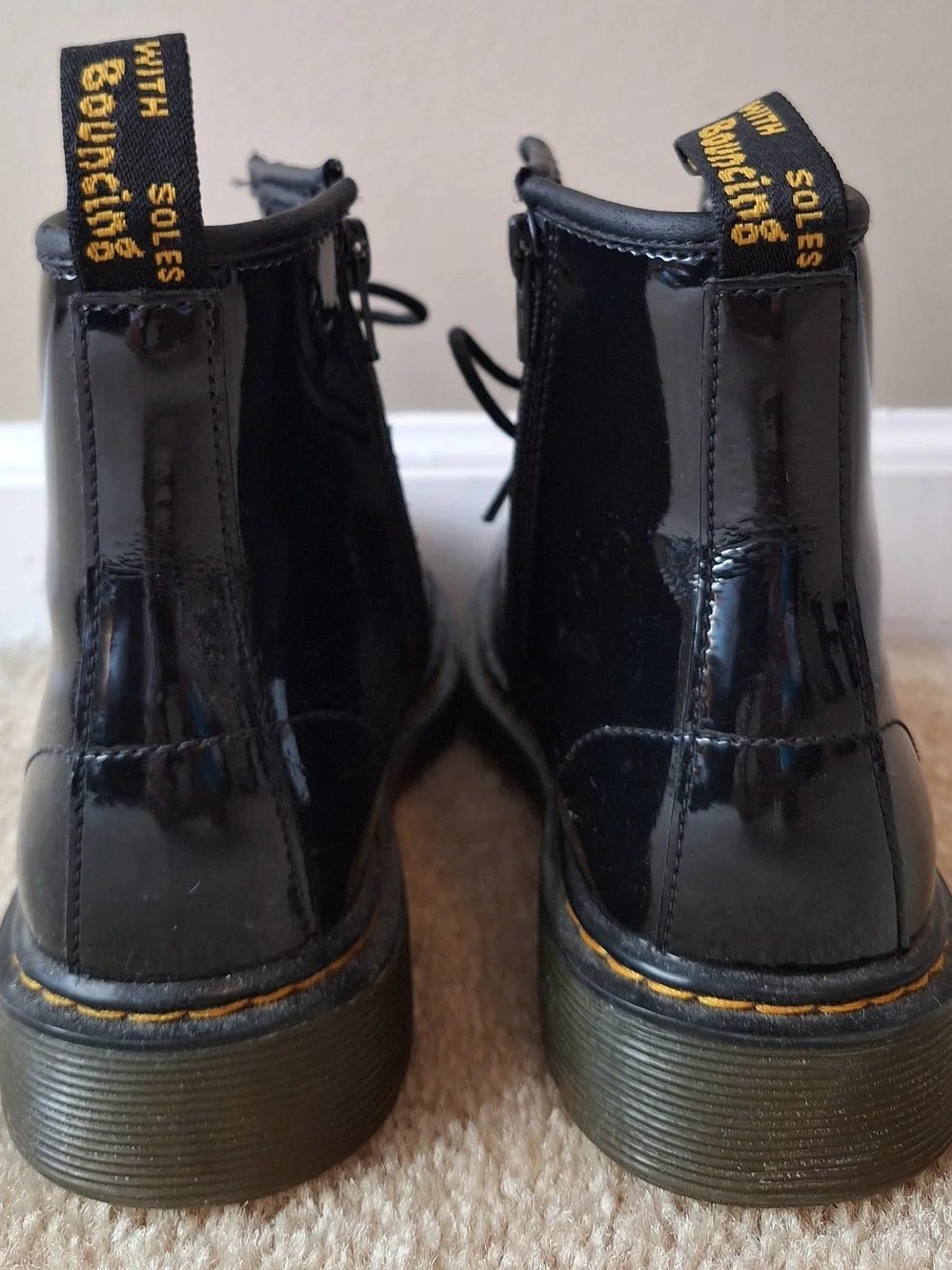 Dr. Martens Black Patent Lace-Up Kids Boots with Yellow Stitching